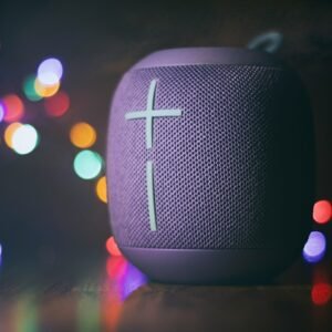 black and gray speaker on brown wooden table