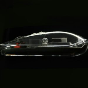 Transparent computer mouse against a black background